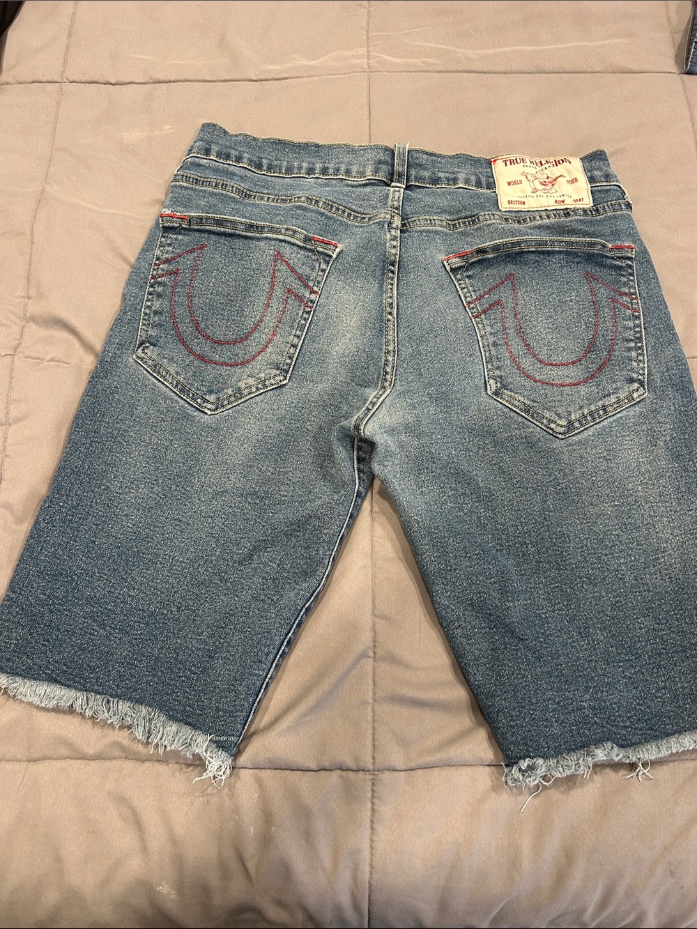 True Religion Medium Blue Denim Cutoff Shorts with Red Pocket Stitching